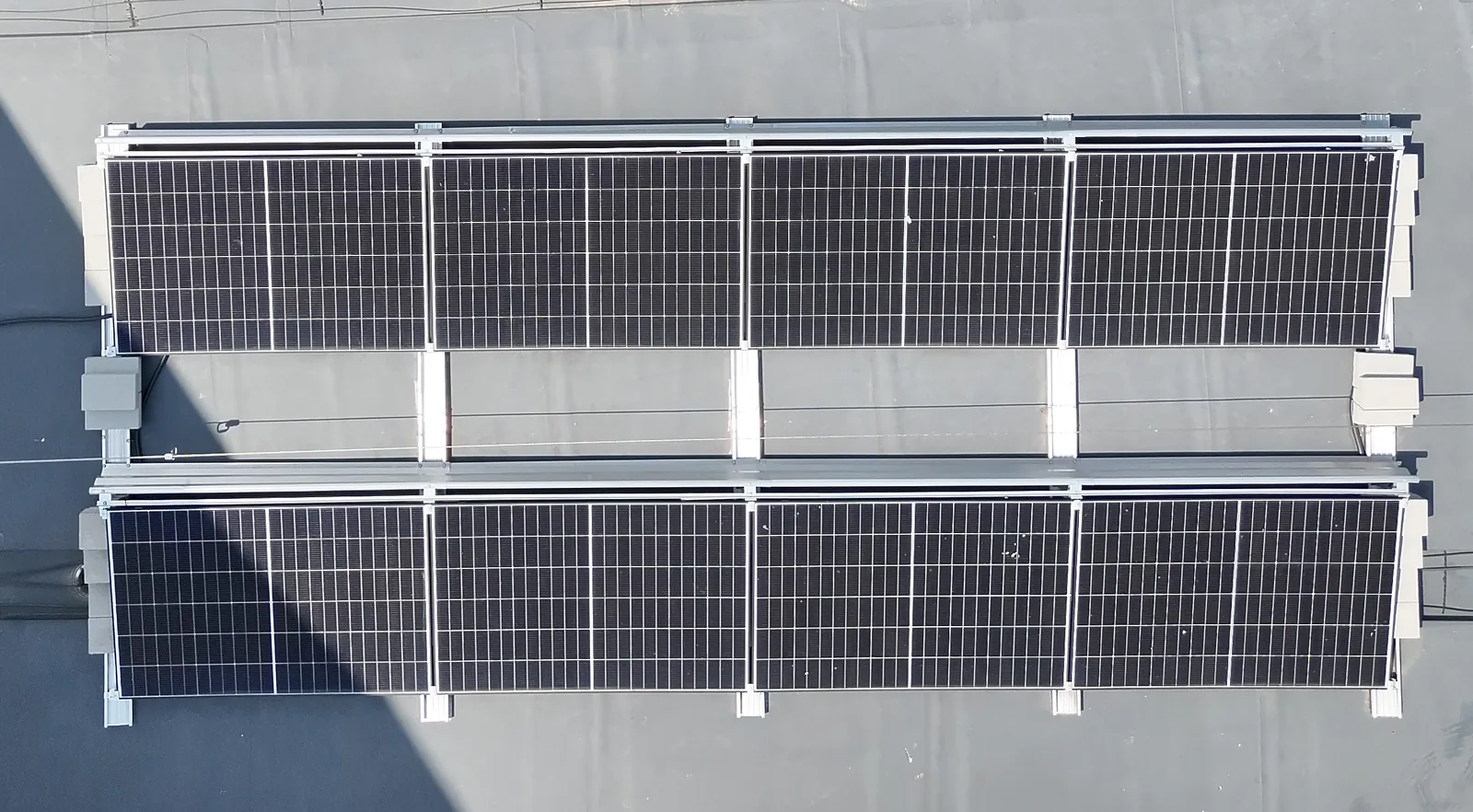 Photovoltaic plant of the municipality of Fernitz-Mellach from the air, two rows with four modules each